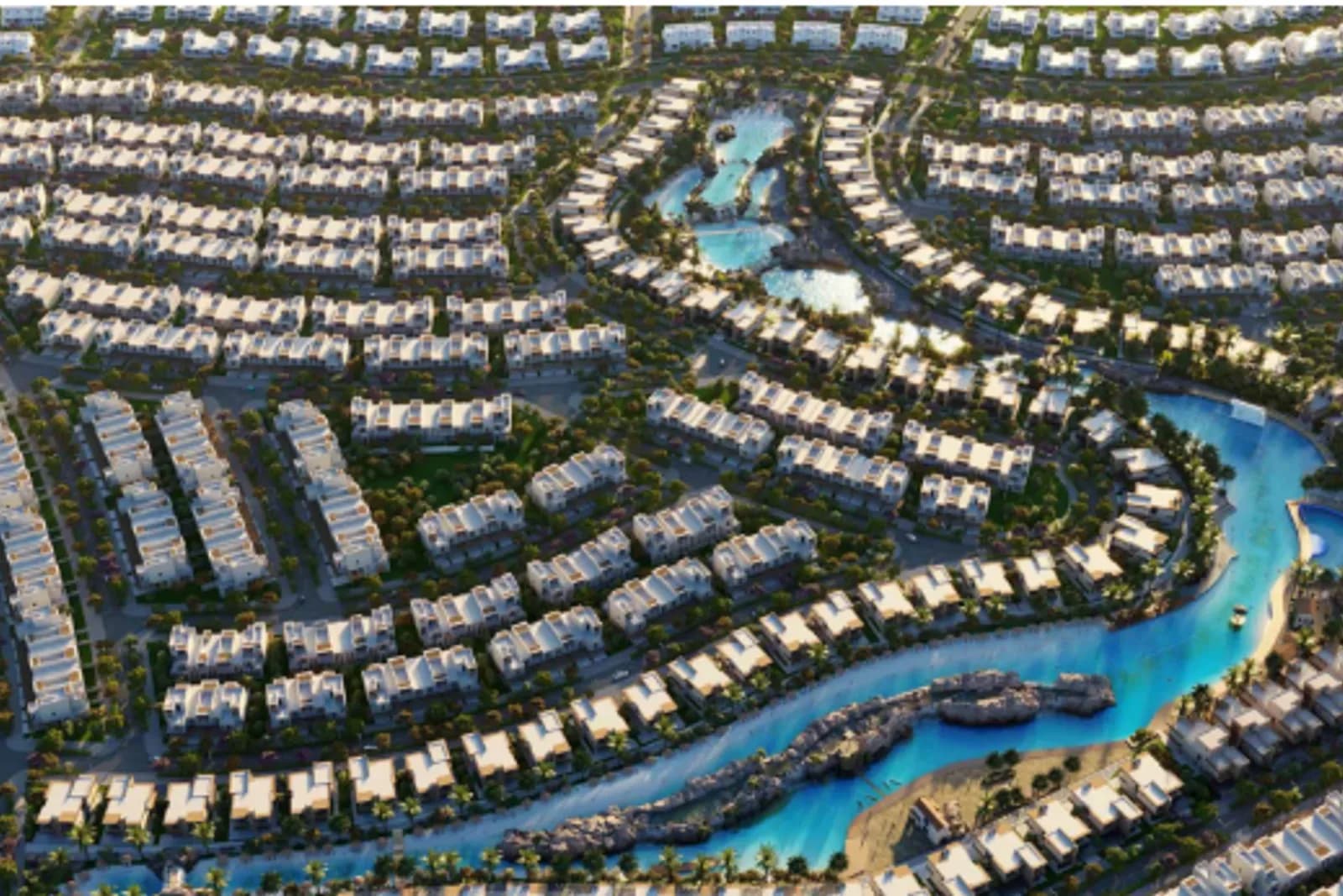 Aerial view of Damac Lagoons' winding turquoise lagoons and villa clusters