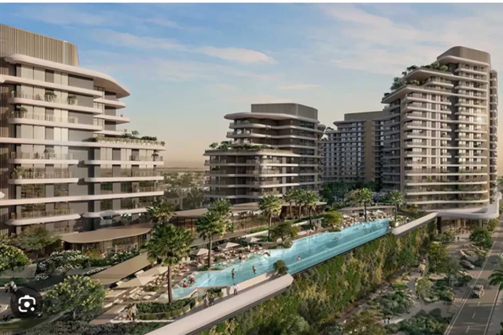 Modern residential towers with a lagoon-style pool in Dubailand